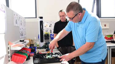 John McIlroy assembling an Andersen wallbox