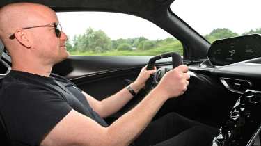 Alex Ingram driving the Lotus Evija