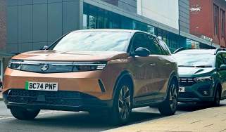 Vauxhall Grandland Electric GS long-term - front 3/4 with a Dacia