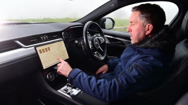 Jaguar F-Pace PHEV and SVR - Pete Gibson operating infotainment screen