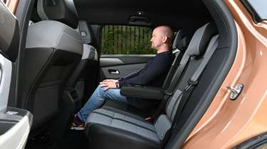 Vauxhall Grandland Electric - rear seats being sat in by Auto Express chief reviewer, Alex Ingram 