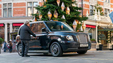 Auto Express chief columnist Mike Rutherford entering the Clive Sutton LEVC TX