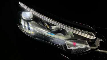 Mercedes EQE - headlight close-up (at night)