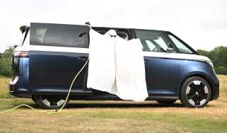 Auto Express head of digital content Steve Walker dressed as a ghost while standing in the Volkswagen ID. Buzz LWB