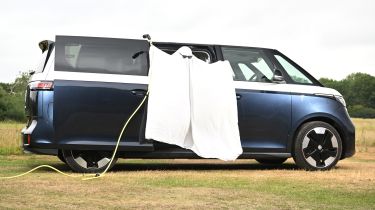 Auto Express head of digital content Steve Walker dressed as a ghost while standing in the Volkswagen ID. Buzz LWB