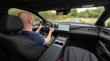 Auto Express chief reviewer Alex Ingram driving the BYD Seal 6 Touring
