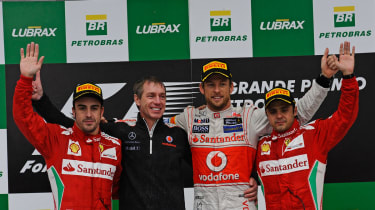 Fernando Alonso, Tim Goss, Jenson Button and Felipe Massa on the podium