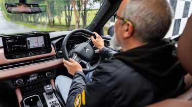 Dean Gibson driving the Mitsubishi Outlander PHEV