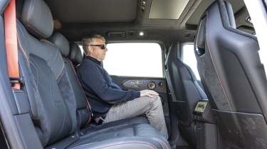 New Zeekr 8X plug-in hybrid - rear seats being sat in by Auto Express editor Paul Barker 