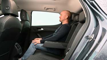 Auto Express chief reviewer Alex Ingram sitting in the SEAT Leon&#039;s back seat