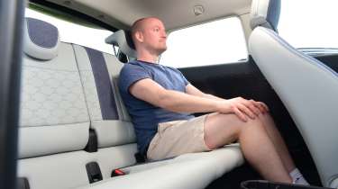 MINI Cooper E - rear seats being sat in by Auto Express chief reviewer Alex Ingram 