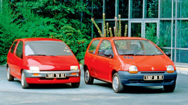 Two red Renault Twingos.