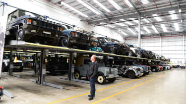 Auto Express editor-in-chief Steve Fowler admiring a collection of vintage Land Rovers