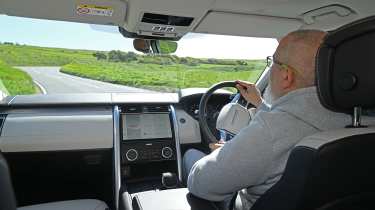 Auto Express senior test editor Dean Gibson driving the Land Rover Discovery Tempest
