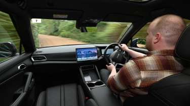 Auto Express news reporter Ellis Hyde driving the BYD Atto 2 DM-i