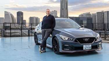 Thomas Geiger standing next to the Nissan Skyline Nismo