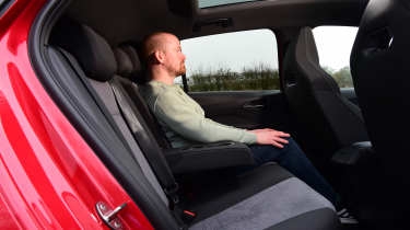 Auto Express cheif reviewer Alex Ingram sitting in the Cupra Born&#039;s back seat