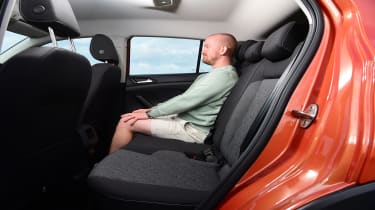 Auto Express chief reviewer Alex Ingram sitting in the back seat of the Volkswagen T-Cross Move