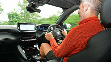 Richard Ingram driving the Peugeot E-2008 GT