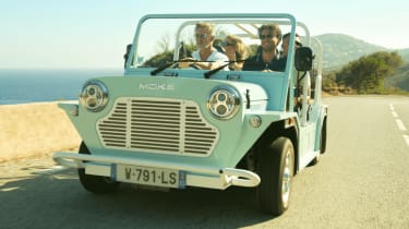 Moke EV driving along beachfront