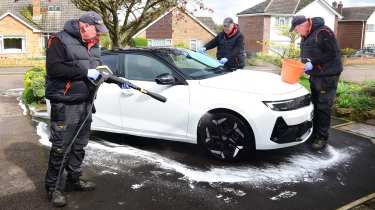 Auto Express products editor Kim Adams washing the Vauxhall Astra GSe