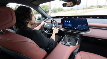 Jordan Katsianis driving the BMW iX3 50 xDrive