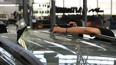 Renault ReFactory - technician working on car roof