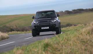 Land Rover Defender OCTA Black - front cornering (dry)