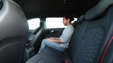 Audi RS 4 Avant vs BMW M3 Touring - Audi rear seats with Auto Express senior staff writer Jordan Katsianis