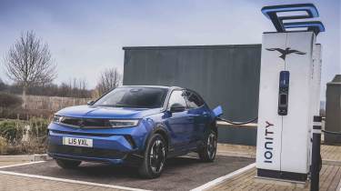 Vauxhall Mokka Electric - front static, charging point