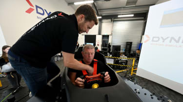 Steve Sutcliffe being briefed about the Dynisma driving simulator