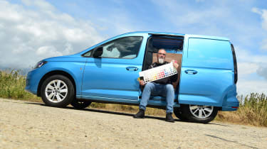 Auto Express senior test editor Dean Gibson sitting in the side of our long-term Volkswagen Caddy Cargo