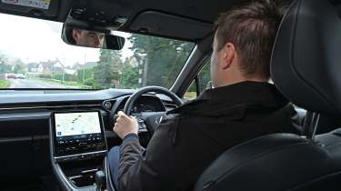 Auto Express senior news reporter Alastair Crooks driving the Lexus LBX