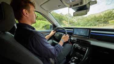 Auto Express senior news reporter Alastair Crooks driving the Citroen e-C3