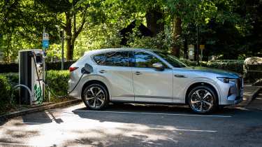 Mazda CX-60 plugged in to charging station