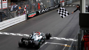 F1 car crossing the finish line