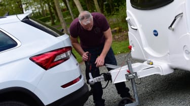 Caravan being attached to a towbar