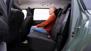Auto Express chief reviewer Alex Ingram sitting in the Dacia Jogger&#039;s middle row seat