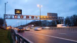 Smart motorway gantry at dusk